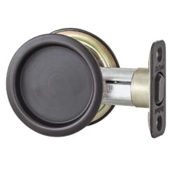 Kwikset Oil Rubbed Bronze Metal Indoor Round Pocket Door Lock
